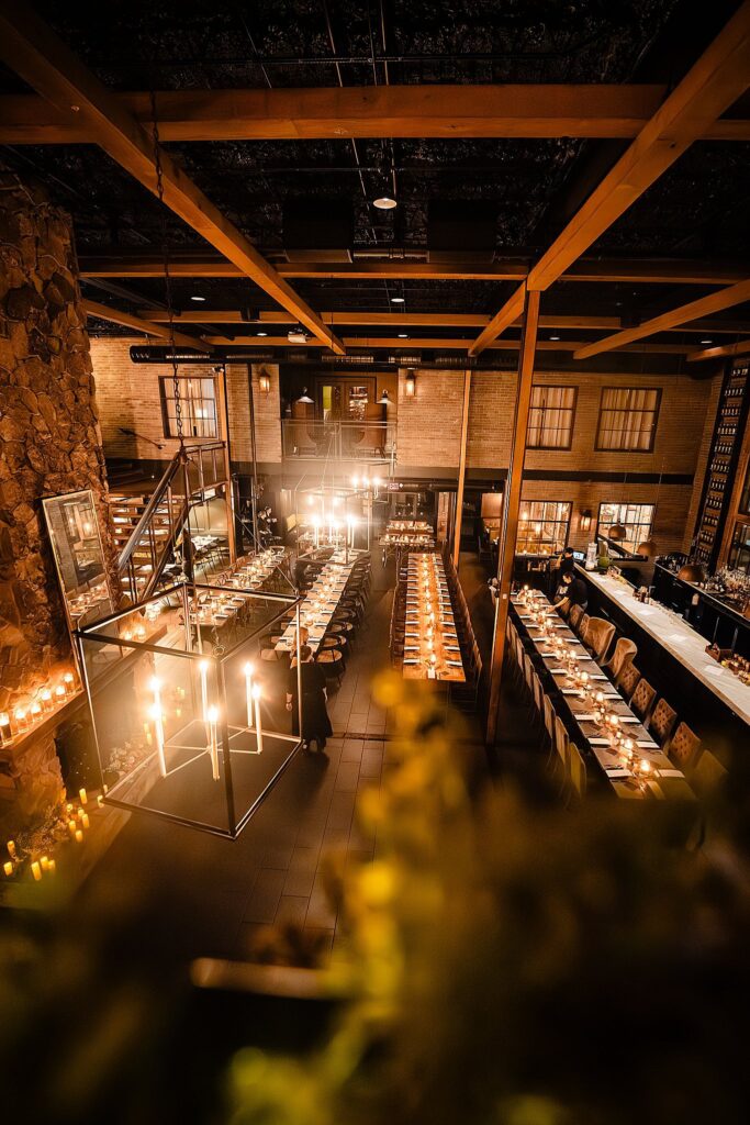 Reception tables long shot fully set at Urban Stillhouse wedding St Pete by Ying Multimedia